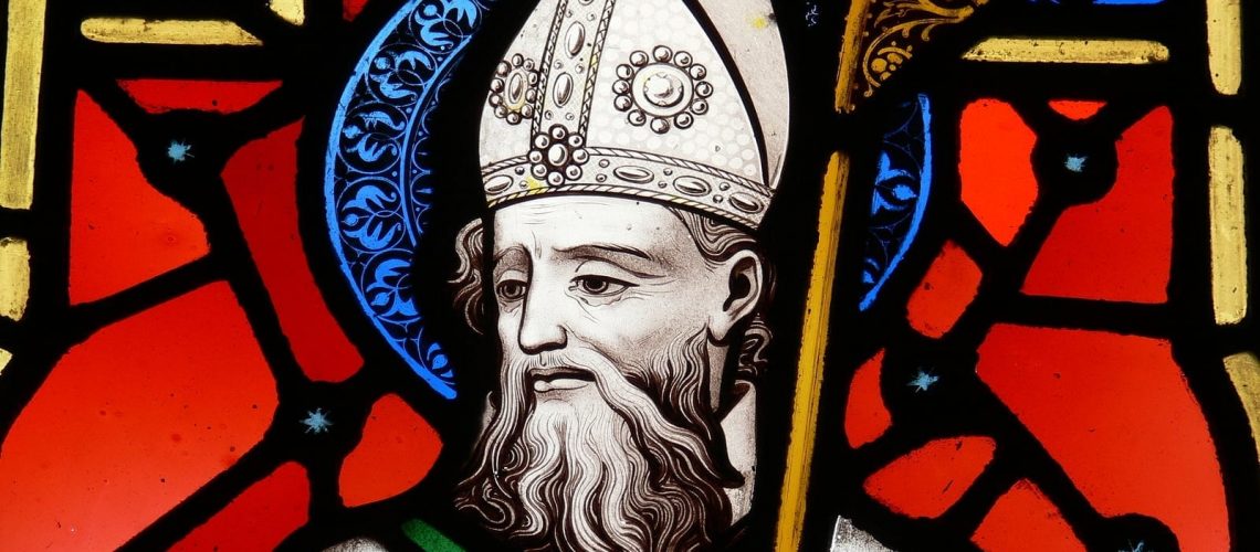 a stained glass image of st. patrick patron saint of ireland.
